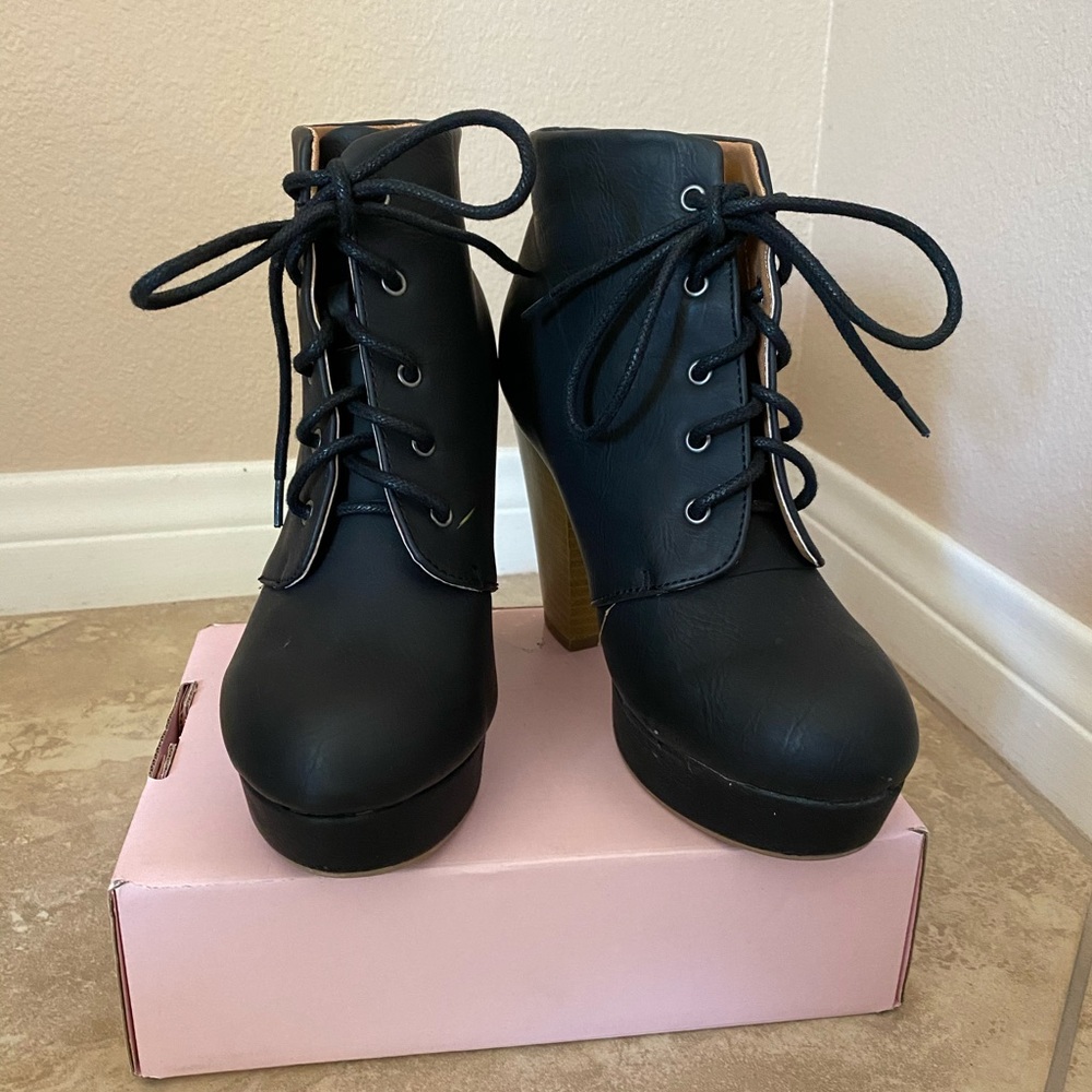 Black heeled combat boots